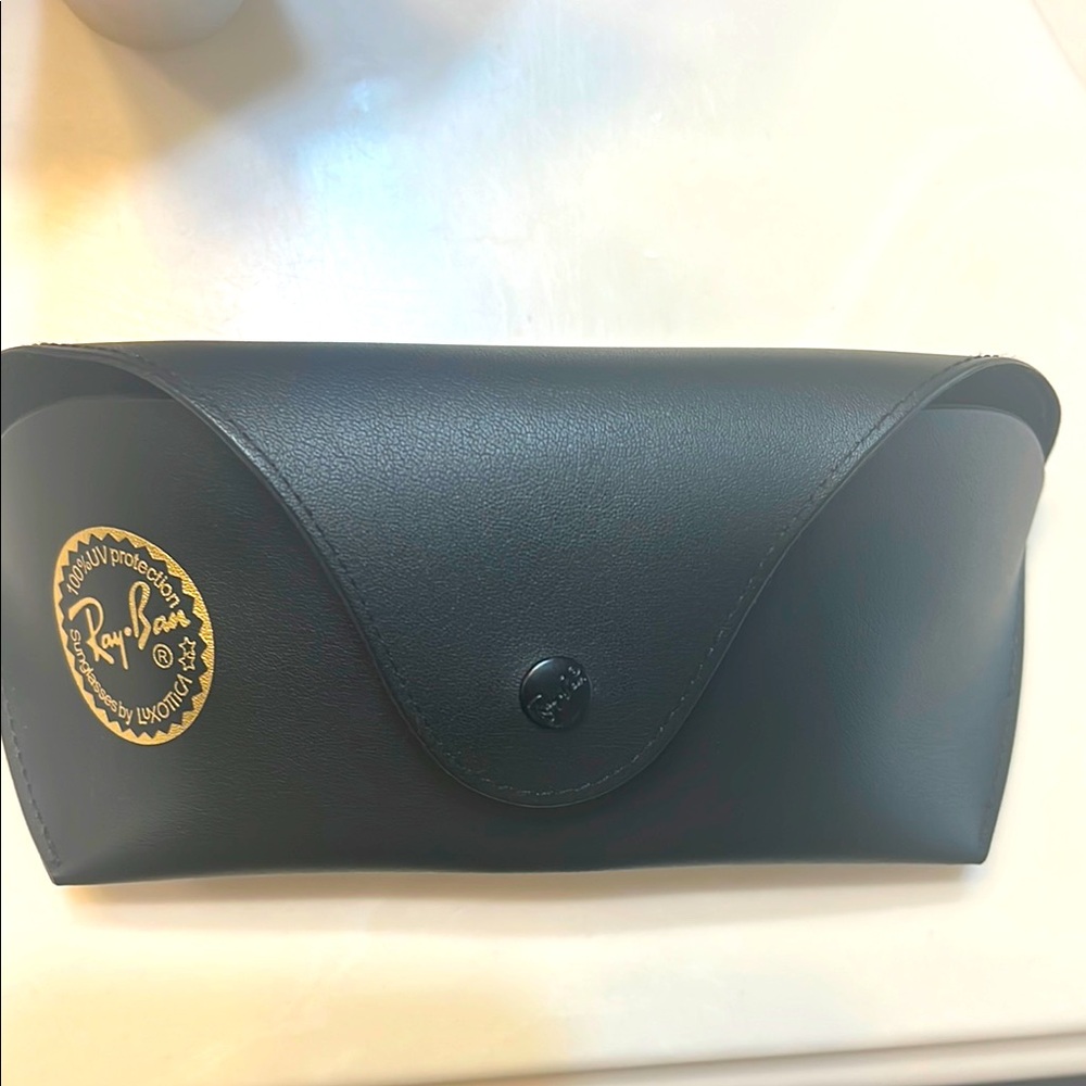 Like new Ray-ban eyeglass case. Black with soft interior and snap closure.